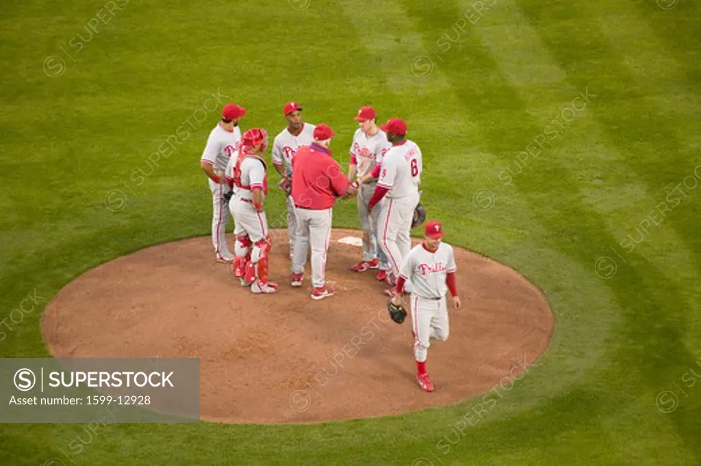 Philadelphia Phillies coach, pitcher and infielders meeting on mound during National League Championship Series (NLCS), Dodger Stadium, Los Angeles, CA on October 12, 2008