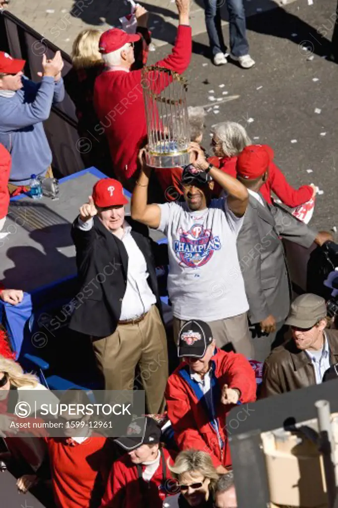 Bus with Philadelphia Phillies and Mayor Michael Nutter hoisting World Series trophy over his head, next to Phillies manager Charlie Manuel, Phillies World Series victory October 31, 2008 with parade down Broad Street Philadelphia, PA