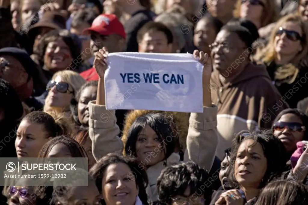 African American holding Yes We Can sign at early vote for change Presidential rally for US Senator Barack Obama, October 29, 2008 at Halifax Mall, Government Complex in Raleigh, NC
