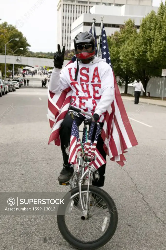 Patriotic bicyclist dressed in American Flag at early vote for change Presidential rally, October 29, 2008 at Halifax Mall, Government Complex in Raleigh, NC