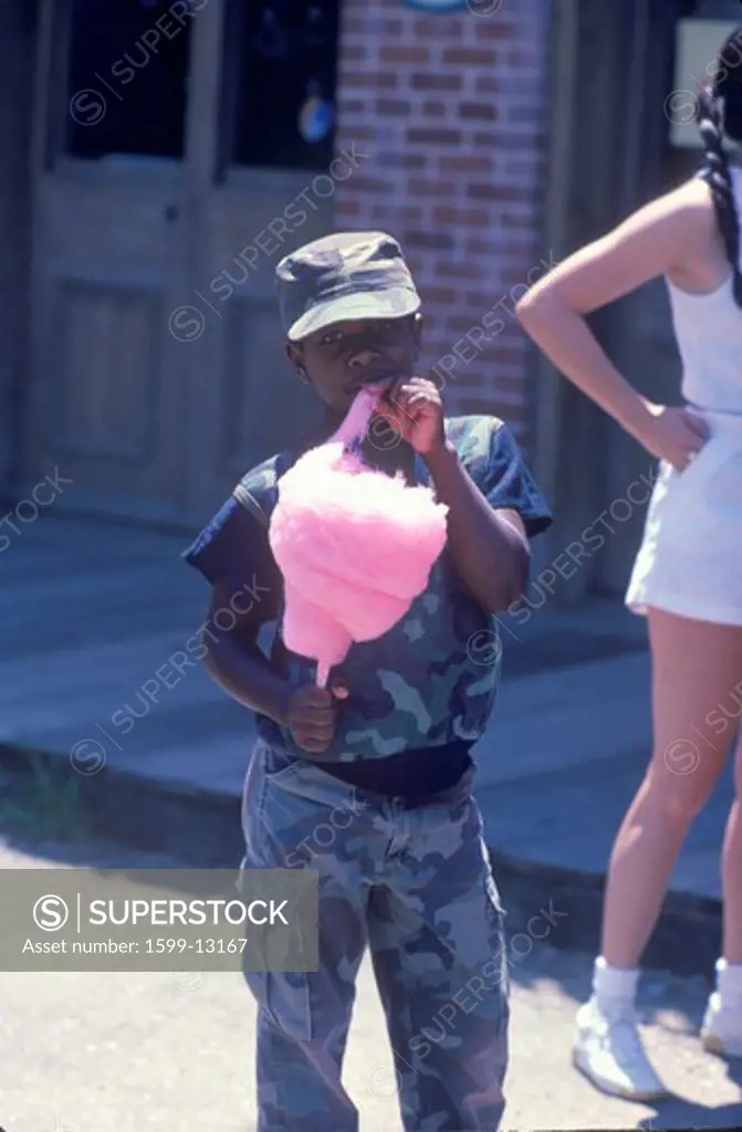 An African-American boy eating cotton candy, Natchez, MI