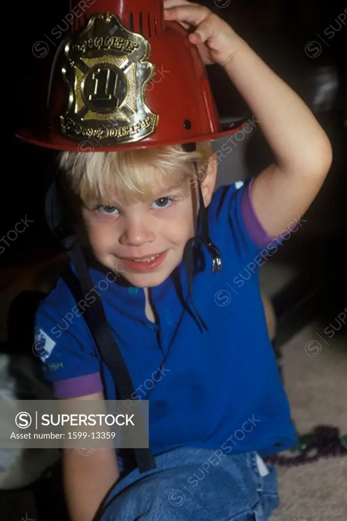 Preschooler playing dress up with Firemans' hat on, Washington, DC