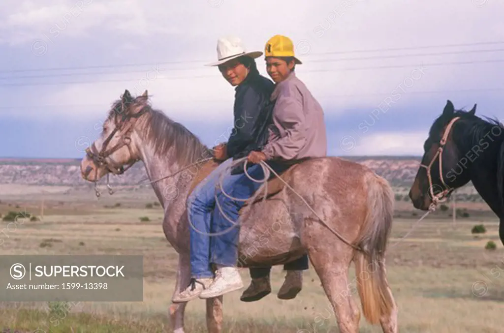 Native American teenagers on horseback, NM