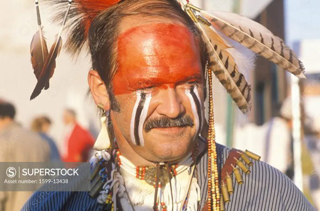 A modern man dressed in Native American face paint, Hannibal, MO