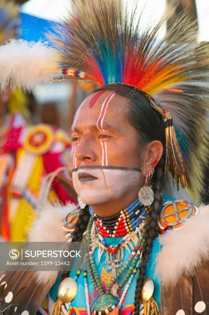 Close-up portrait of Native American in full regalia dancing at Pow wow