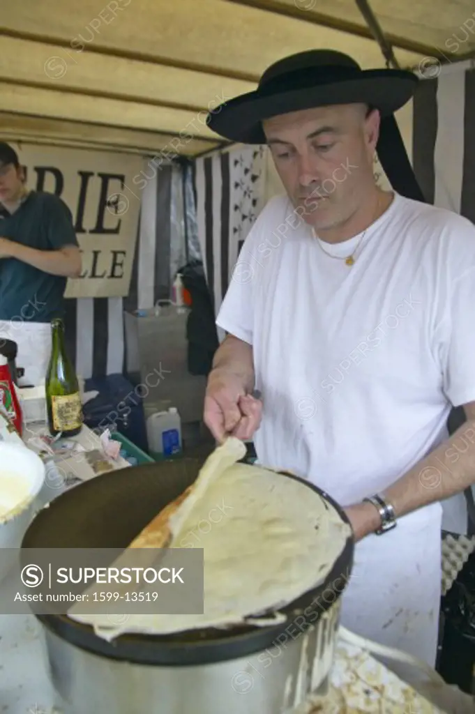 Crepe Stand with man making crepe at the Flea Market, Paris, France