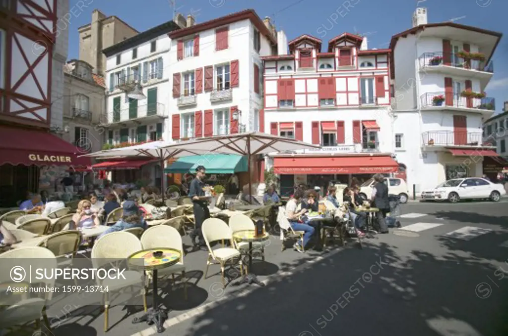 St. Jean de Luz, on the Cote Basque, South West France, a typical fishing village in the French-Basque region near the Spanish border, shows the cute village with red awnings and shutters