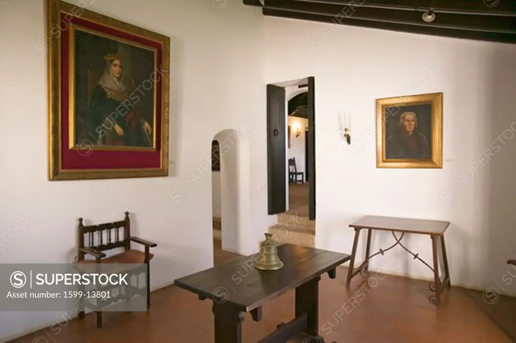 Interior room with paintings of Christopher Columbus and his sponsor, Spanish Queen Isabella, as seen at the 15th-century Franciscan Monasterio de Santa María de la Rábida, Palos de la Frontera, the Huelva Provence of Andalucia and Southern Spain, the site where Christopher Columbus planned and departed from the Old World to the New World in August 3 of 1492