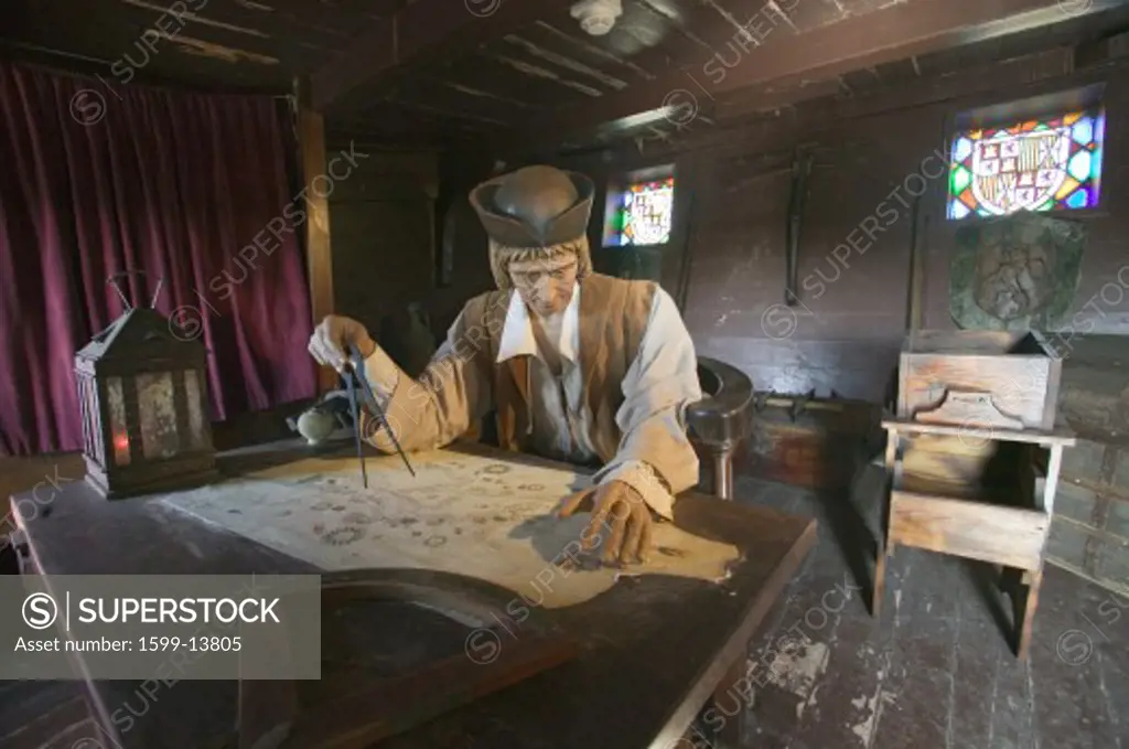 Model of Christopher Columbus at desk with map in his cabin at Muelle de las Carabelas, Palos de la Frontera - La Rábida, the Huelva Provence of Andalucia and Southern Spain, the site where Columbus departed from the Old World to the New World in August 3 of 1492