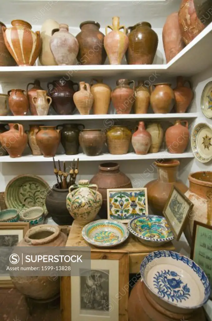 Pottery store shows stacks of old pots in old part of Centro, Sevilla Spain