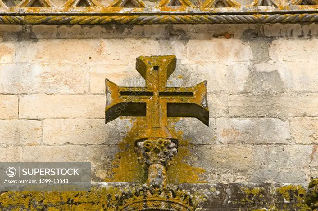 Detail of early Christian cross on wall of Chapter House, Templar Castle and the Convent of the Knights of Christ, founded by Gualdim Pais in 1160 AD, is a Unesco World Heritage Site in Tomar, Portugal