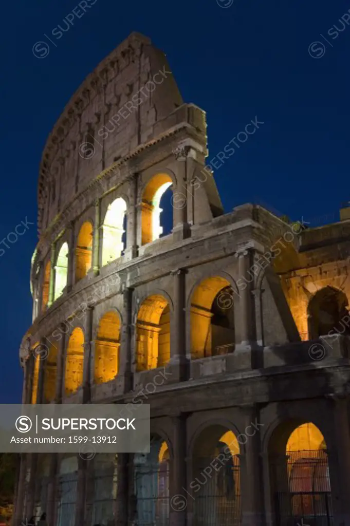 The Colosseum or Roman Coliseum at dusk, originally the Flavian Amphitheatre, an elliptical amphitheatre in the centre of the city of Rome, the largest ever built in the Roman Empire, Rome, Italy, Europe