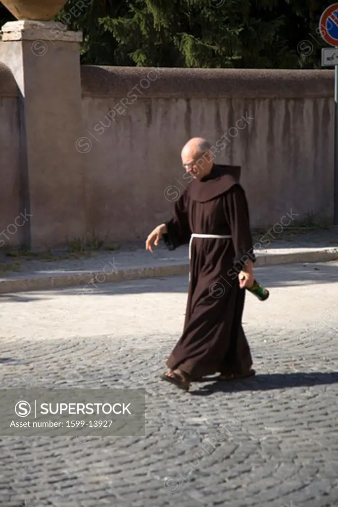 Priest walking near Villa d'Este in Tivoli near Rome, Italy, Europe