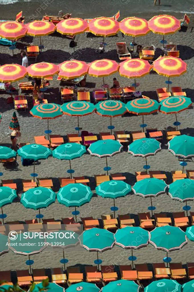 Elevated pattern view of famous beach umbrellas of Amalfi, a town in the province of Salerno, in the region of Campania, Italy, on the Gulf of Salerno, 24 miles southeast of Naples