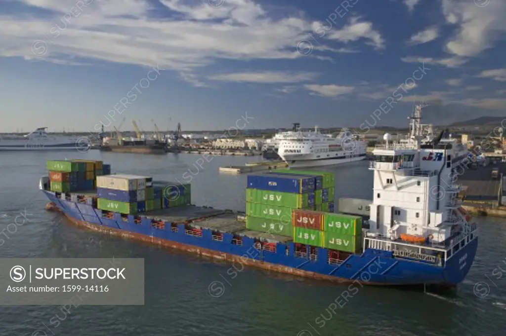 Cargo ship carrying containers departing Port of Civitavecchia, Italy, the Port of Rome