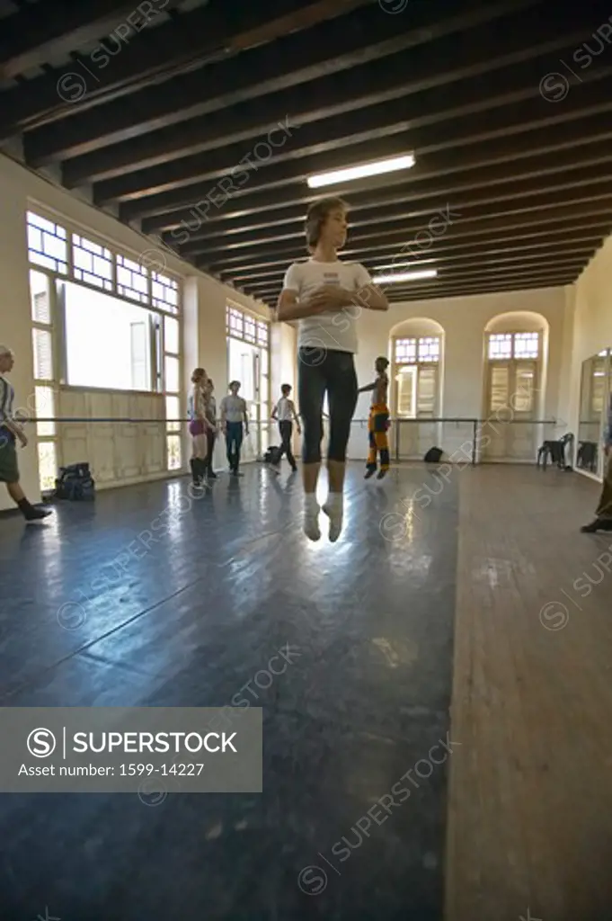 Male dancer jumping into air at Pro Danza Ballet dance studio and school, Cuba
