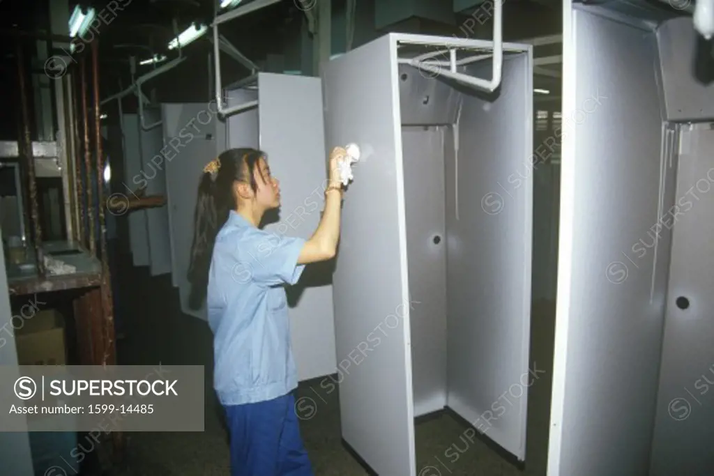 Factory workers at Shanghai Shangling Electric Appliances Company, Ltd., in Shanghai, People's Republic of China