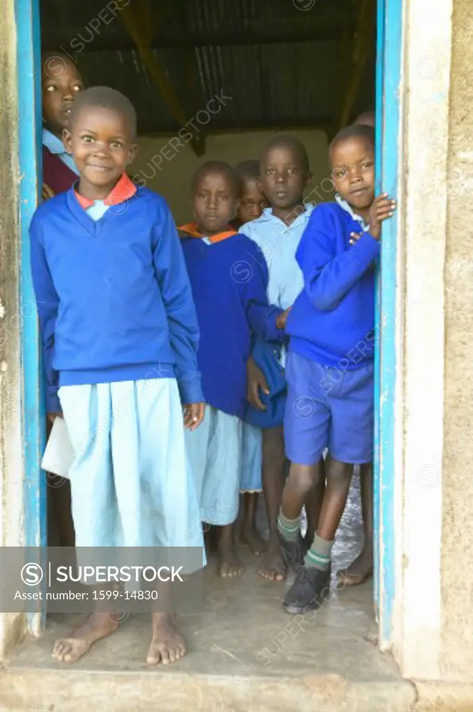 Children in blue uniforms at school near Tsavo National Park, Kenya, Africa