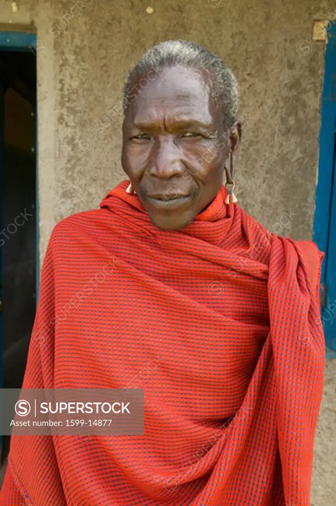 Masai Senior Elder man in red robe in village near Tsavo National Park, Kenya, Africa