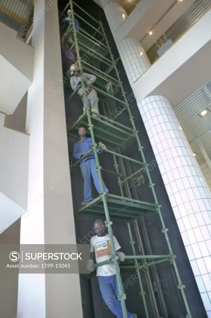 Hotel workers work on five elevator levels in Durban, South Africa