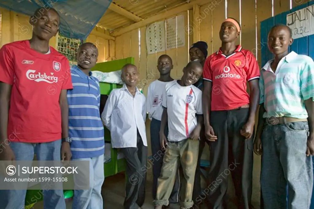 A group of young Kenyan males, who are affected with HIV/AIDS, pose for camera at Pepo La Tumaini Jangwani, HIV/AIDS Community Rehabilitation Program, Orphanage & Clinic.  Pepo La Tumaini Jangwani (wind of hope in the arid place) offers hope, support and care for orphan and vulnerable children living with HIV/AIDS in Nairobi, Kenya, Africa