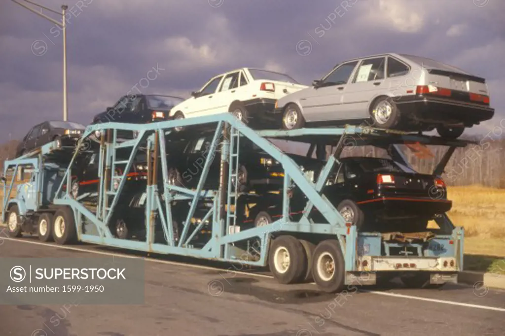 Automobile transport truck hauling cars