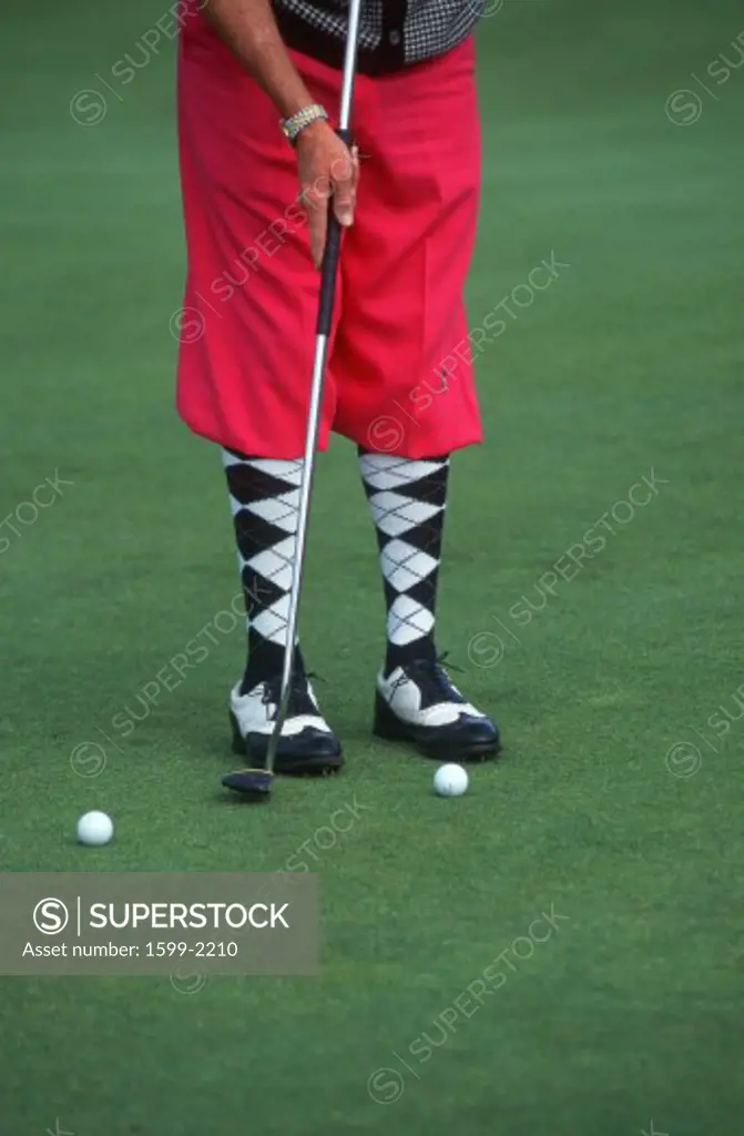 Golfer wearing argyle socks and pink golf pants, Ojai, California