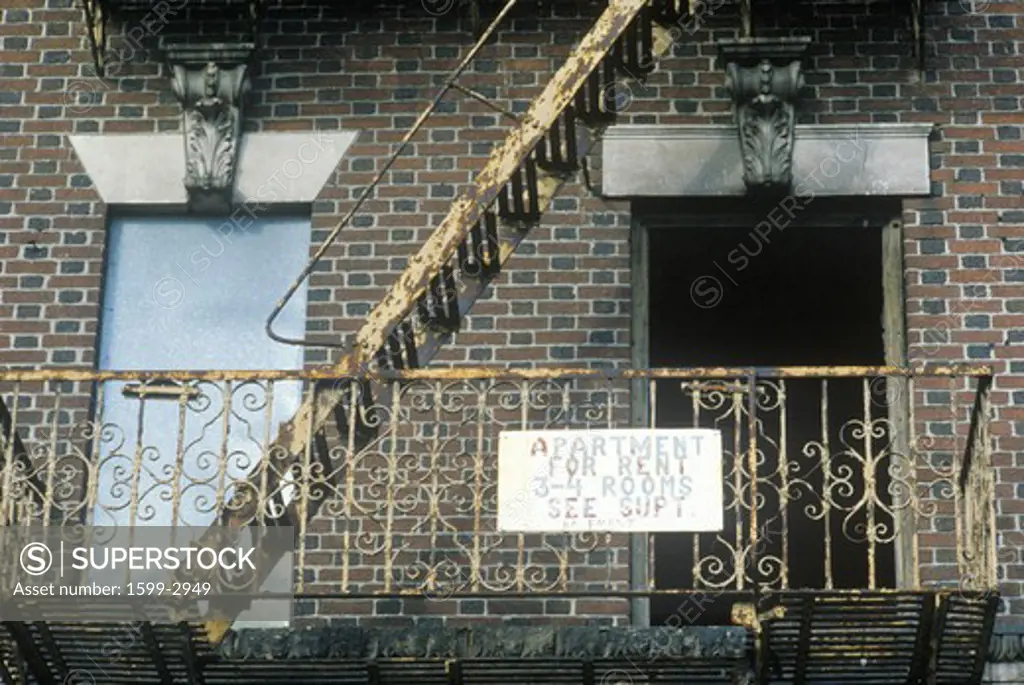 Fire escape and apartment for rent sign, South Bronx, New York