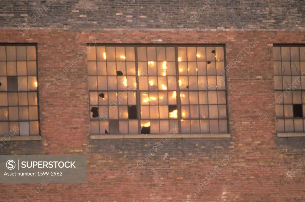 Broken windows of an abandoned brick factory building, South Bend, Indiana
