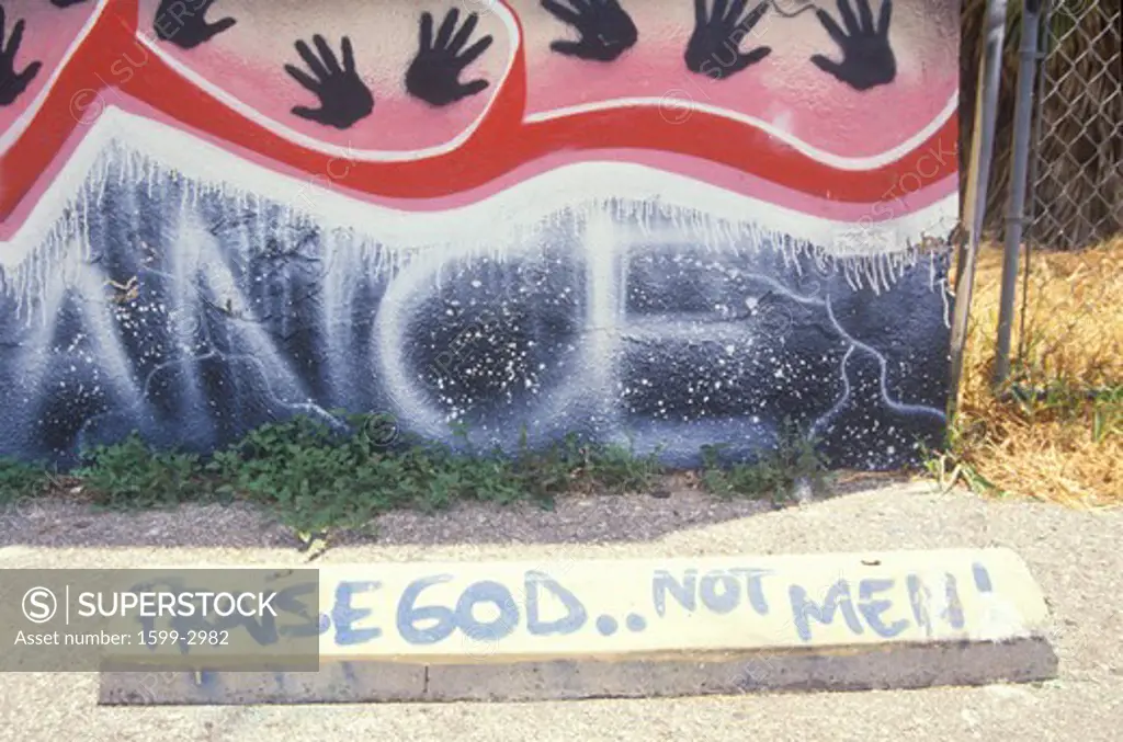 Graffiti reading Praise God not men”, South Central Los Angeles, California
