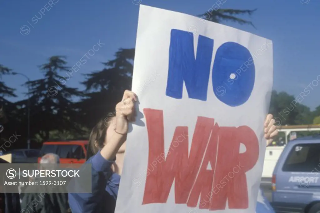 Sign No War” at peace rally,  Los Angeles, California