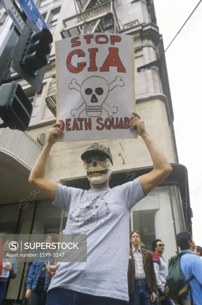 Protester wearing skeleton mask protesting CIA, Los Angeles, California