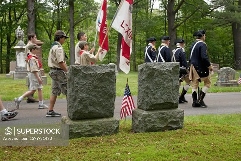 Historic Lexington Cemetery on Memorial Day, 2011 where Boy Scouts and Revolutionary soldiers honor fallen soldiers, MA