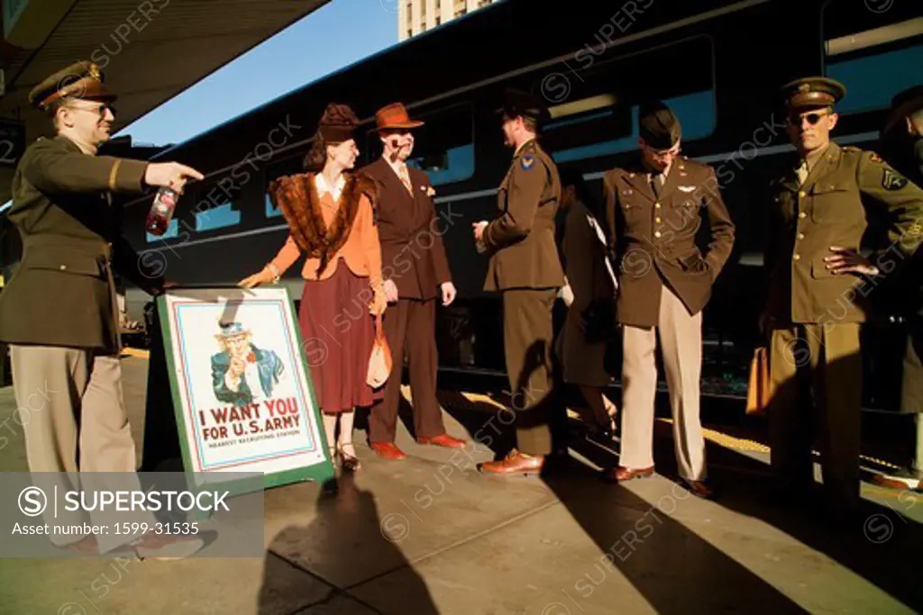 1940's reenactors stand in front of Pearl Harbor Day Troop train reenactment from Los Angeles Union Station to San Diego