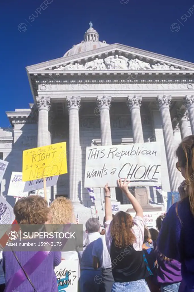 Women at pro-choice rally holding signs at State Capitol Building, Missouri
