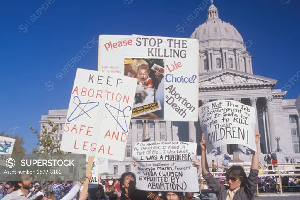 Women's rights marchers holding signs at State Capitol Building, Missouri