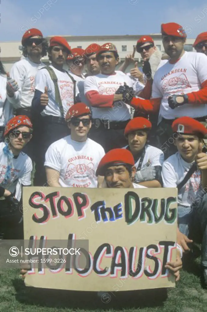 The Guardian Angels anti-violence activists holding signs and posing for camera, Los Angeles, California