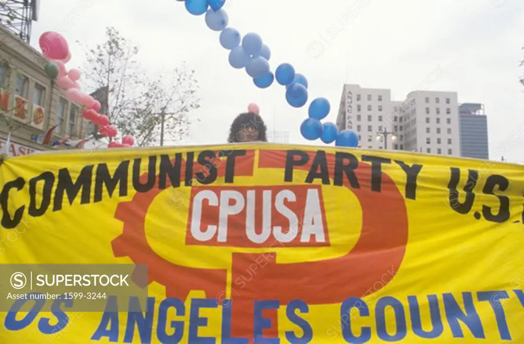 Pro-communist marchers holding banner, Los Angeles, California