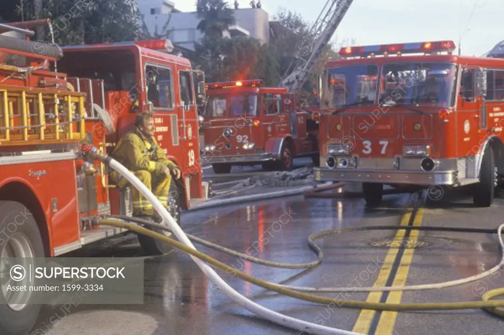 Firefighters working at apartment fire, Los Angeles, California