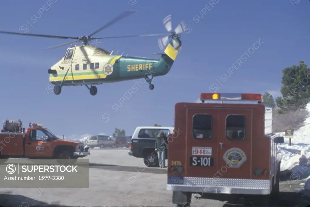 Sheriff's helicopter departing with emergency rescue, San Bernardino Mountain, California