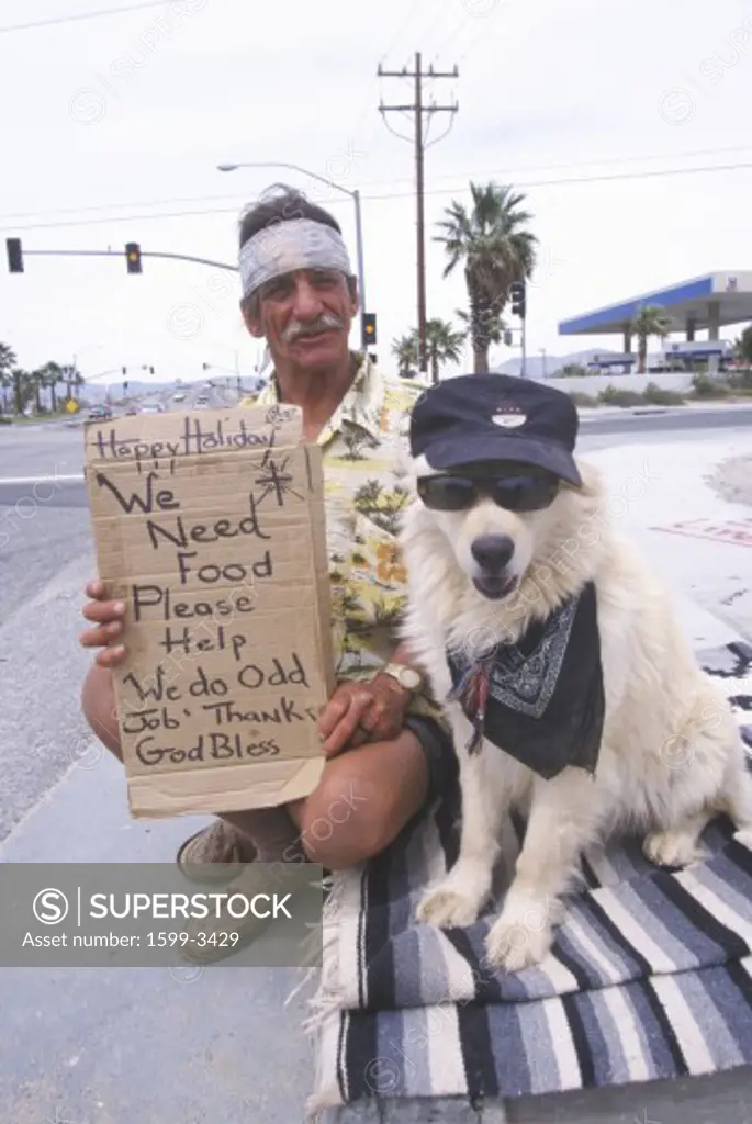 A homeless man and his dog will work for food
