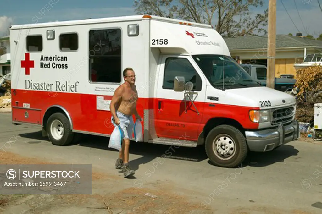 Victims of Hurricane Ivan in Pensacola Florida suburb come to Red Cross emergency for food, water and ice