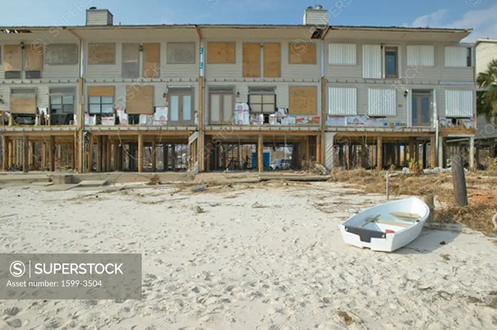 Row boat and waterfront house hit heavily by Hurricane Ivan in Pensacola Florida