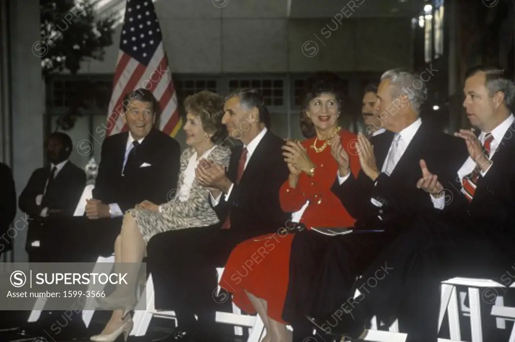 President Ronald Reagan, Mrs. Reagan and California governor George Deukmejian applaud Ronald Reagan