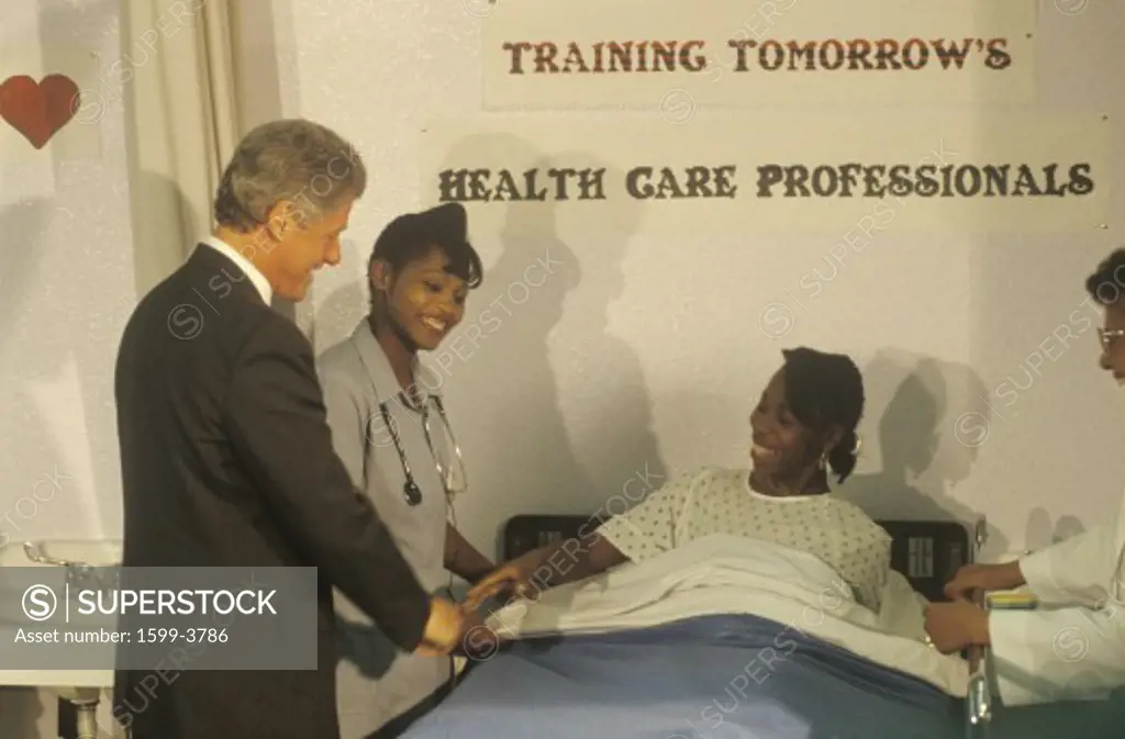 Governor Bill Clinton greets patient at a nurse's job training program at the Maxine Waters Employment Preparation Center in 1992, So. Central, LA