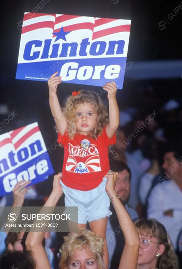 Little girl with Clinton/Gore sign stands out in the crowd during the Clinton/Gore 1992 Buscapade campaign tour in Tyler, Texas 