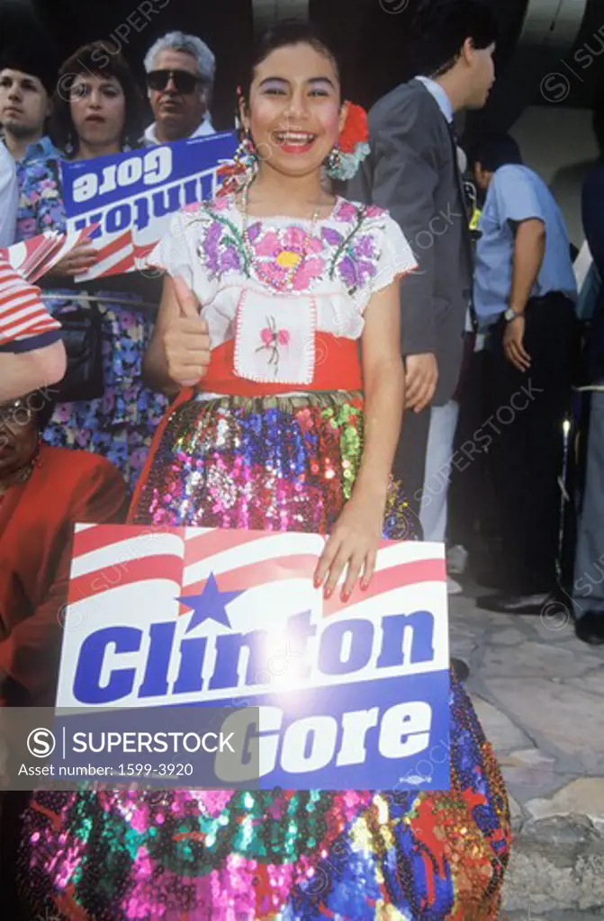 Costumed girl poses at the Clinton/Gore Arneson River 1992 Buscapade campaign tour in San Antonio, Texas
