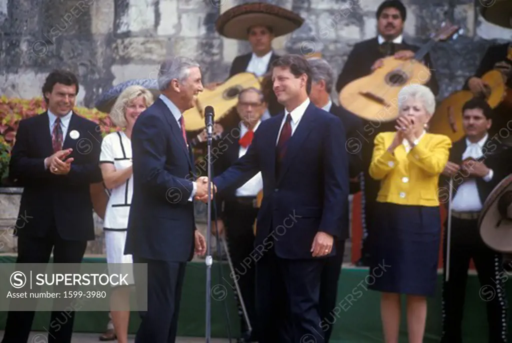 Senator Al Gore shakes hands with Senator Lloyd Bentsen at Arneson River during the Clinton/Gore 1992 Buscapade campaign tour in San Antonio, Texas