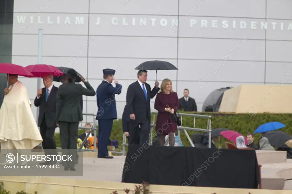 Heads of state along with former VP Al Gore and wife Tipper Gore walk on stage during the official opening ceremony of the Clinton Presidential Library November 18, 2004 in Little Rock, AK