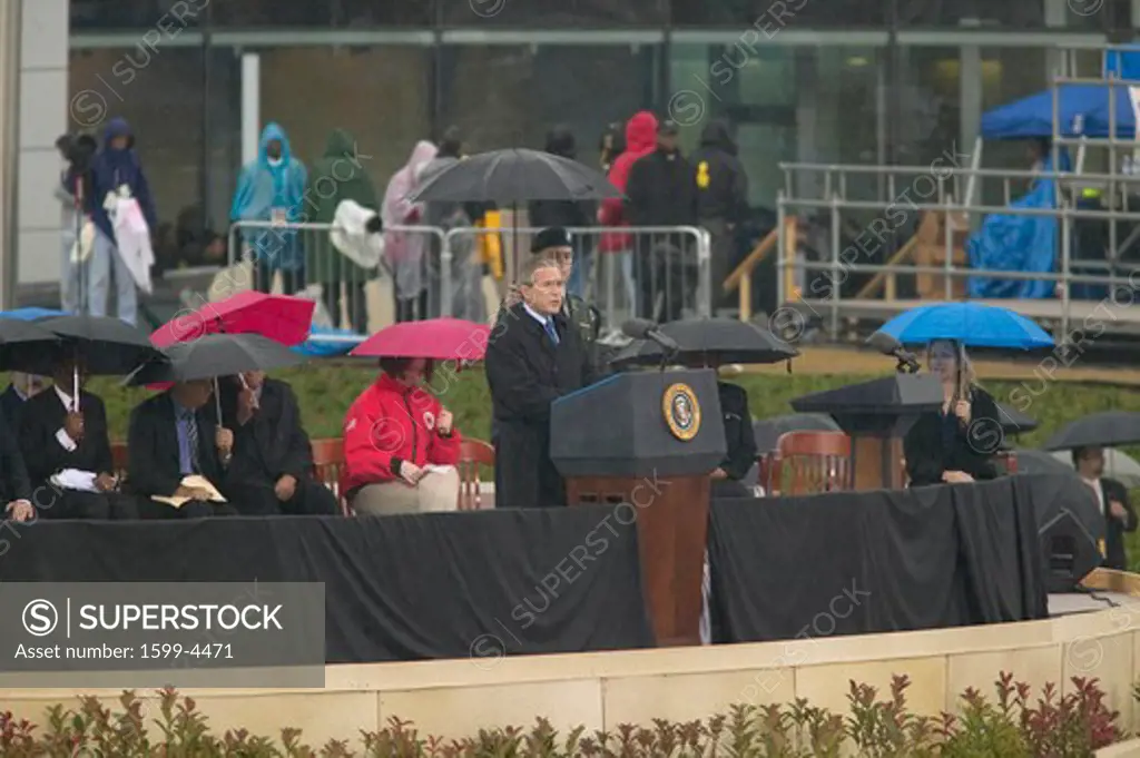 US President George W Bush speaks during the grand opening ceremony of the William J. Clinton Presidential Center in Little Rock, AK 18 November 2004.